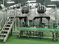 Machine d'emballage avec peseuse associative