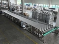 Pasteurisateur à bain-marie avec convoyeur à rouleaux