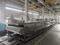Pasteurisateur à bain-marie avec convoyeur à rouleaux